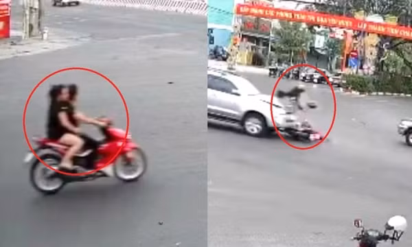 Đôi nam nữ đi xe máy nẹt pô, vượt đèn đỏ bị ô tô húc văng