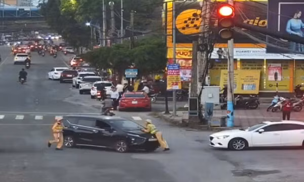 Tạm giữ hình sự đối tượng hất thiếu tá CSGT lên nắp capo