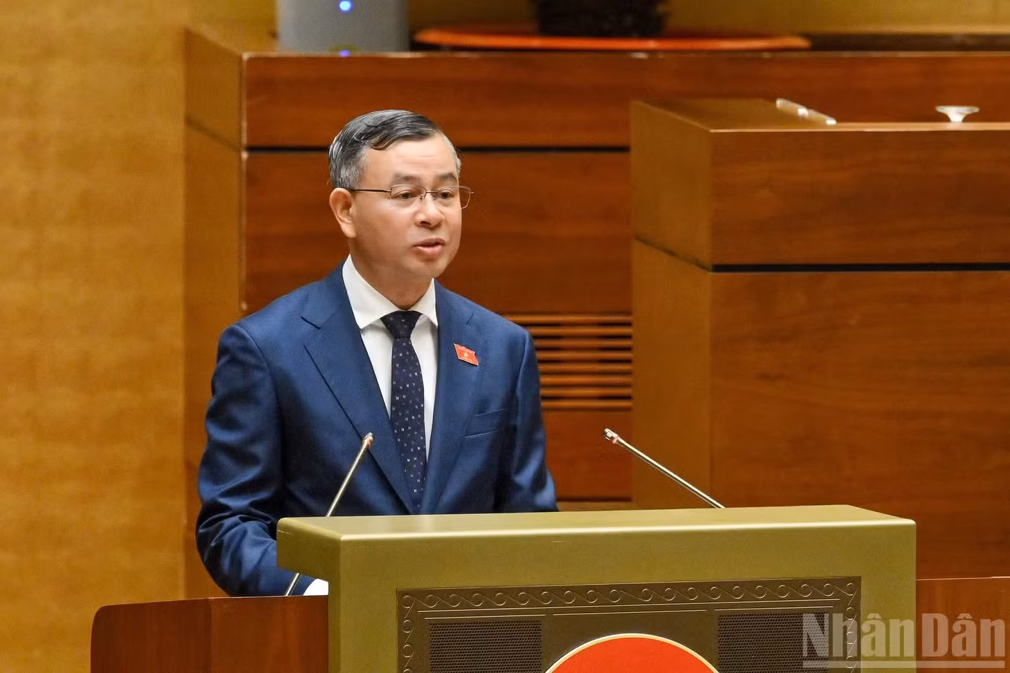 Bộ trưởng Tài chính Ngô Văn Tuấn trình bày tờ trình tóm tắt dự án Luật. (Ảnh: THỦY NGUYÊN)